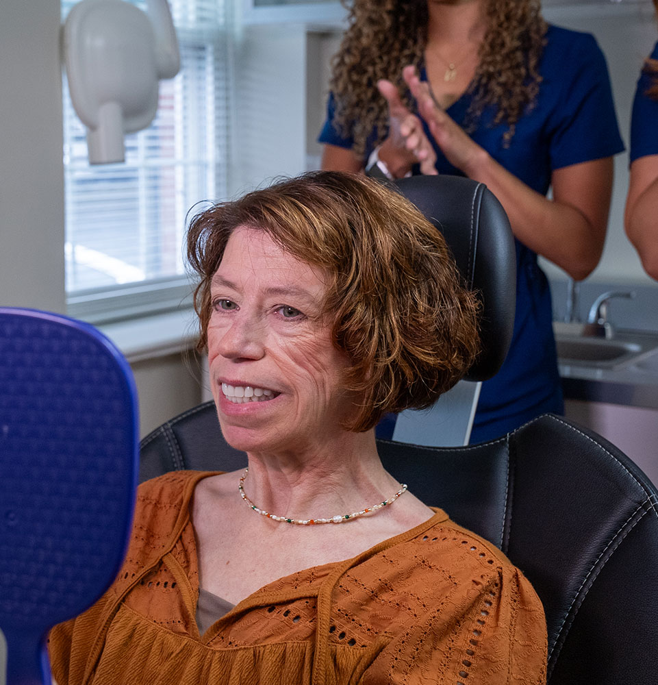 patient smiling brightly after their dental procedure