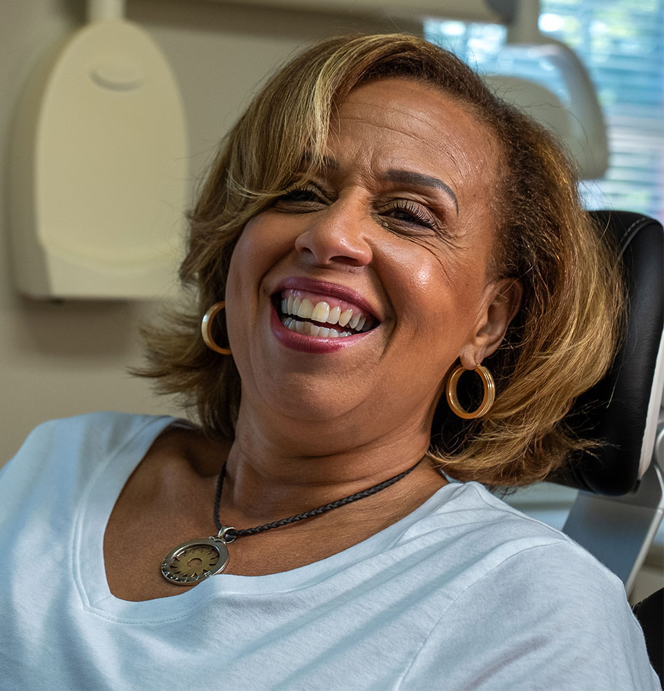 patient smiling brightly after their dental procedure