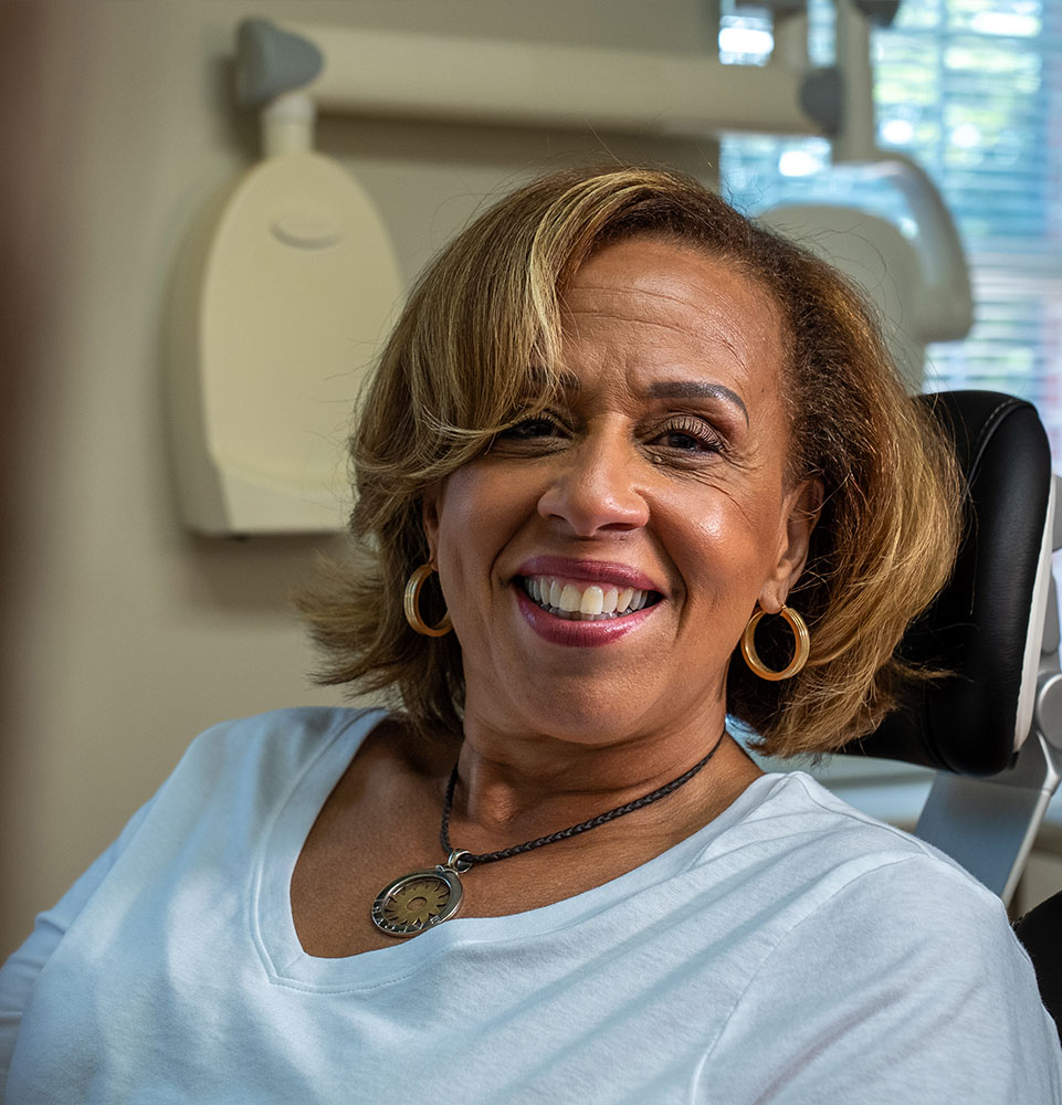 patient smiling brightly after their dental procedure