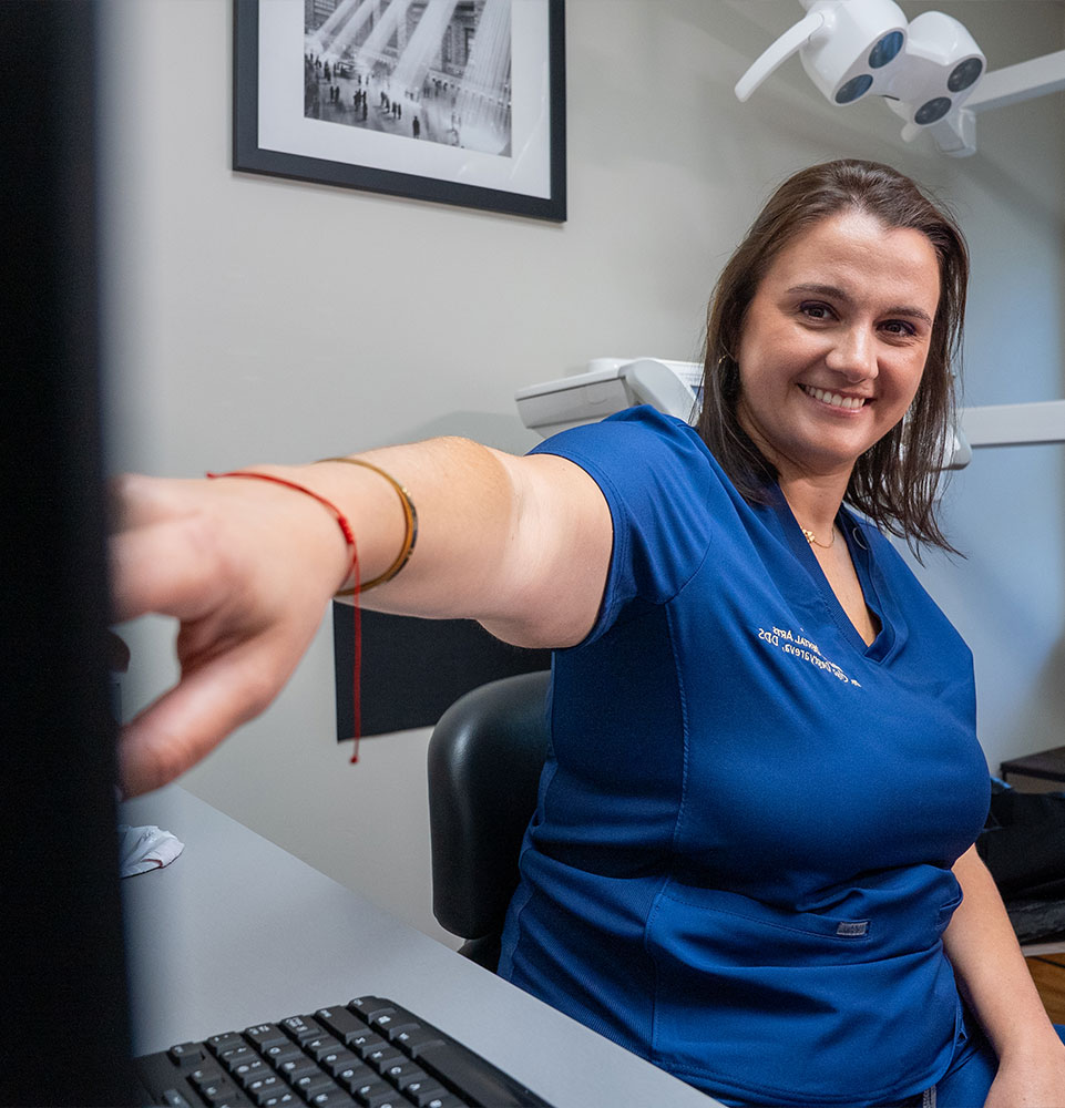 doctor examining dental information for patient procedure