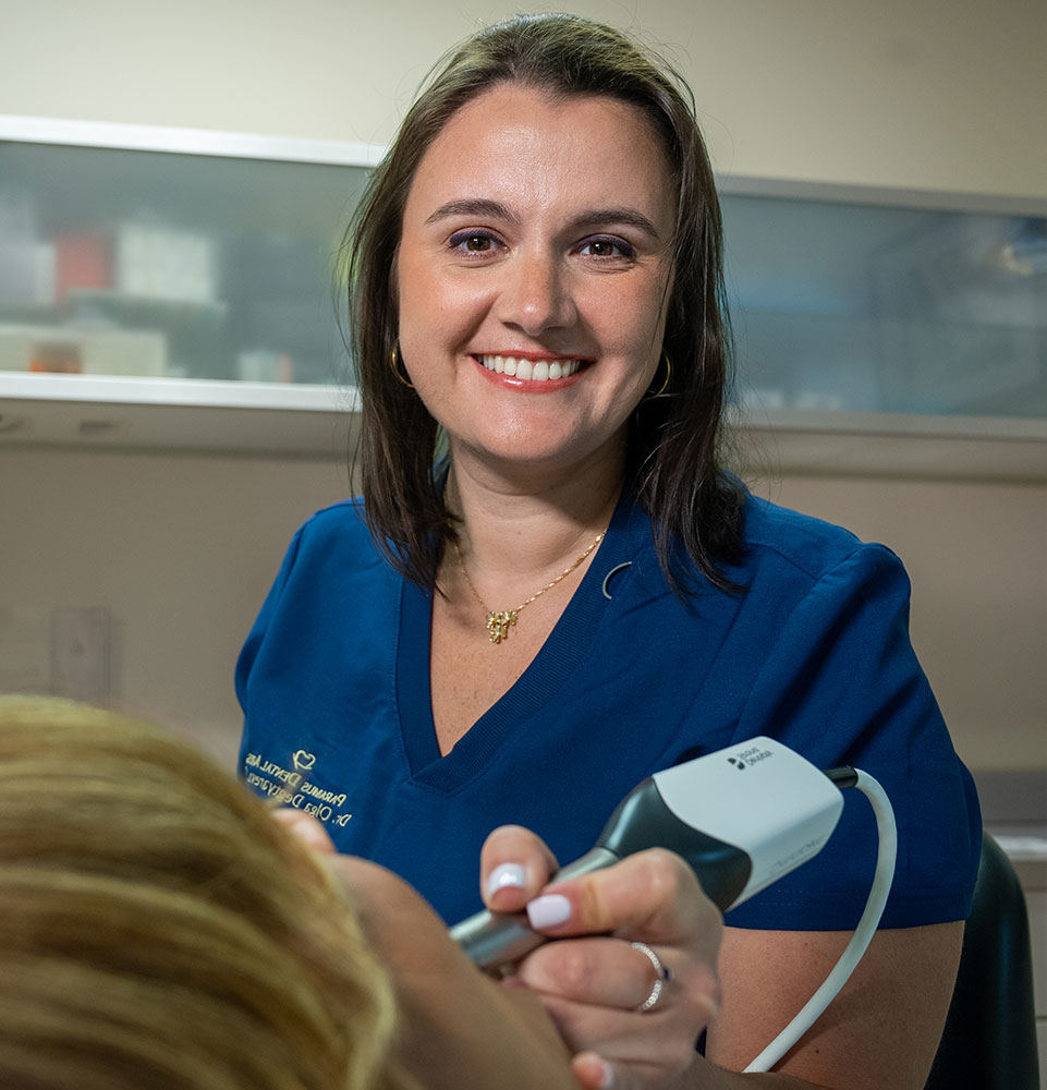 doctor smiling brightly while performing examining on patient