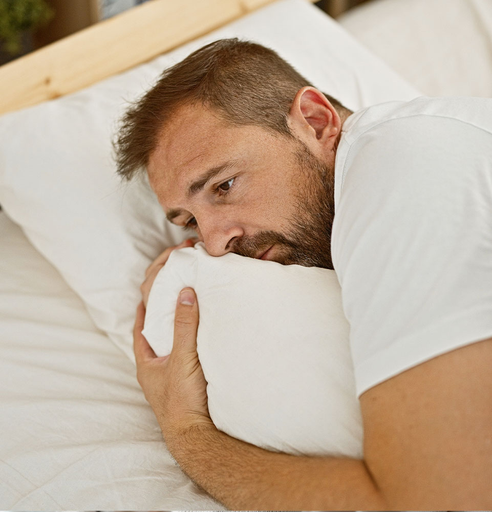 male having a hard time going to sleep