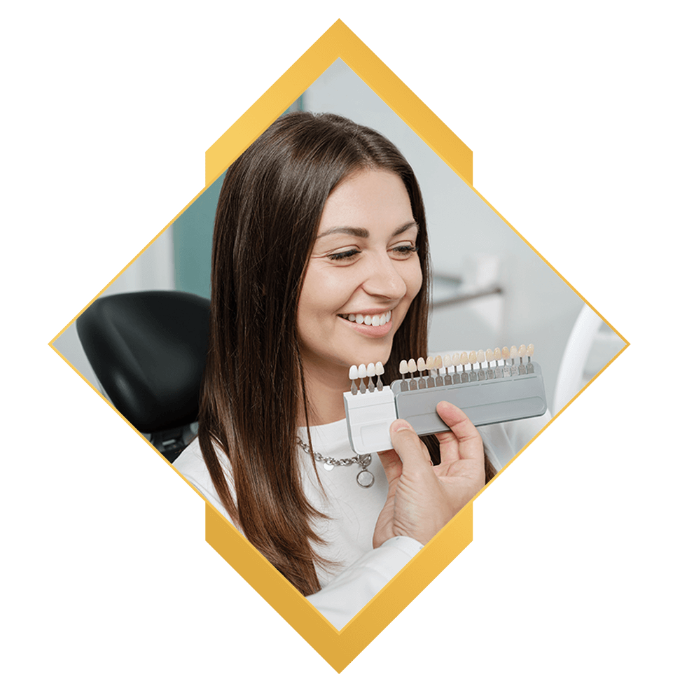 patient having a model veneer being showcased within the dental center